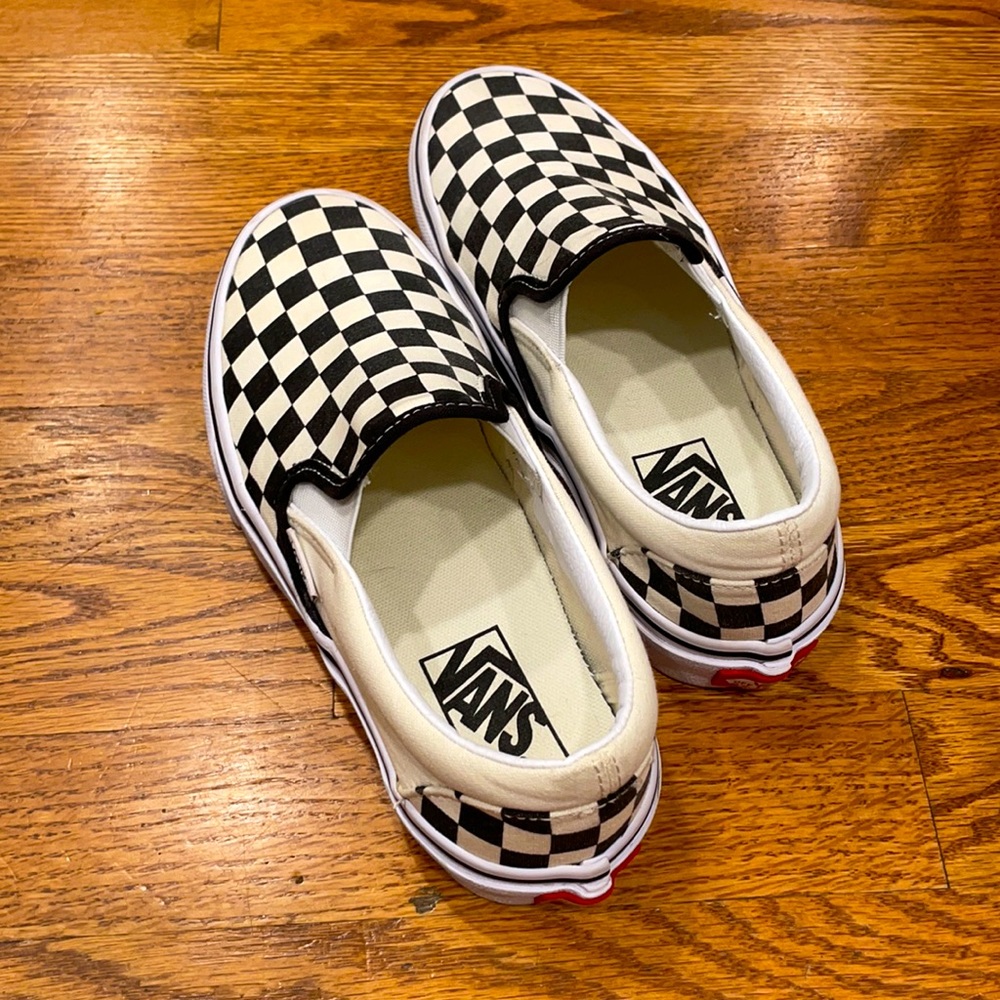Black/off white checkered slip-on vans